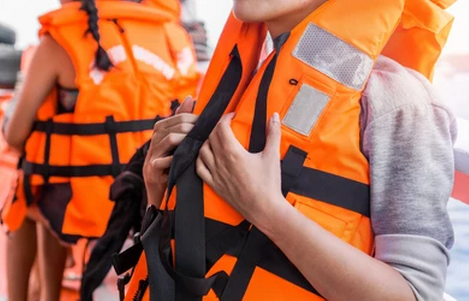 People in an orange life vest